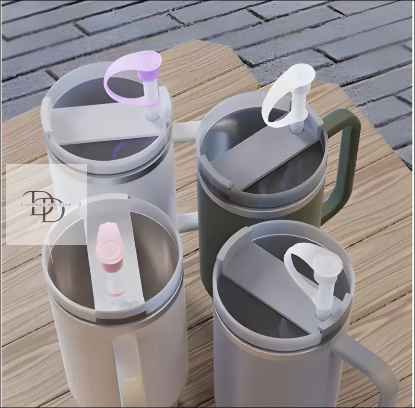 Insulated travel mugs with flip-top lids in different colors.