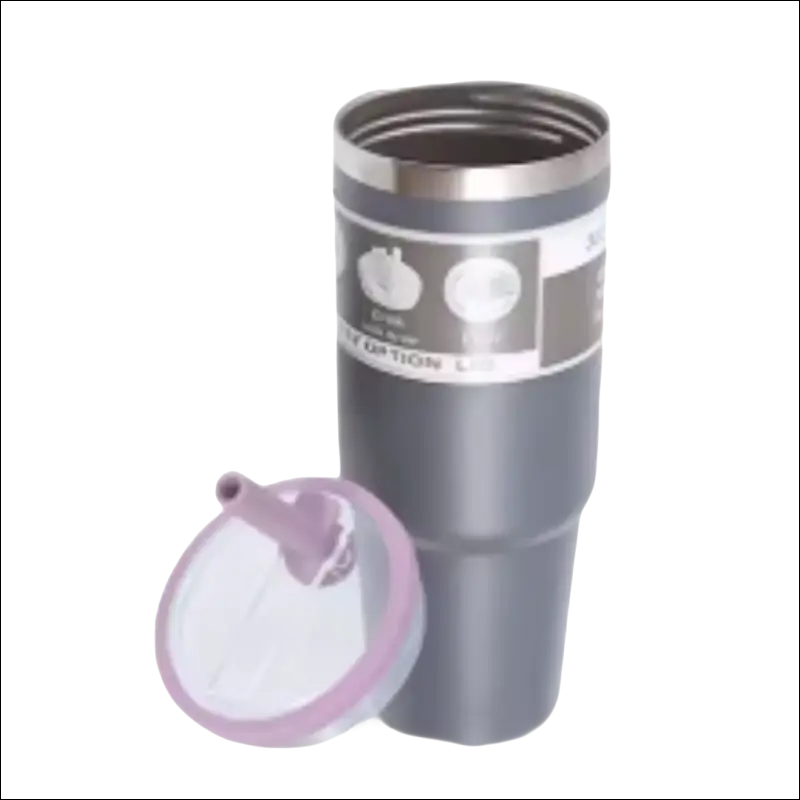 Gray travel mug with apple designs and a pink lid.