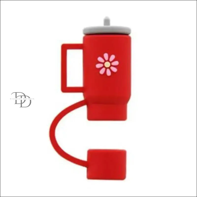 Red travel mug with a curved handle and flower design.