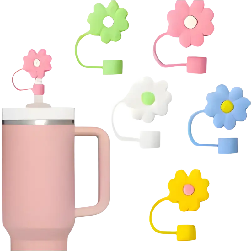 Pink insulated travel mug with a flower-shaped lid attachment.