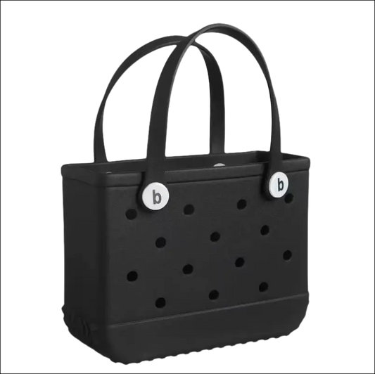 Black perforated handbag with two handles and circular white accents.