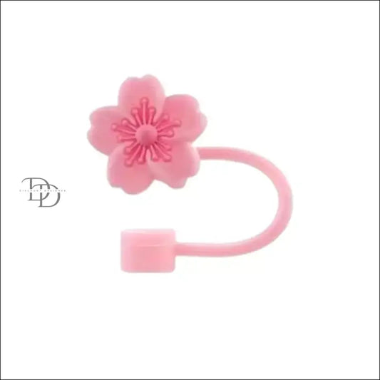 Pink cherry blossom-shaped cable protector or cord organizer.