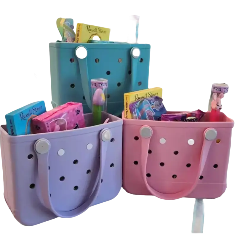 Colorful perforated plastic tote bags filled with children’s books and toys.